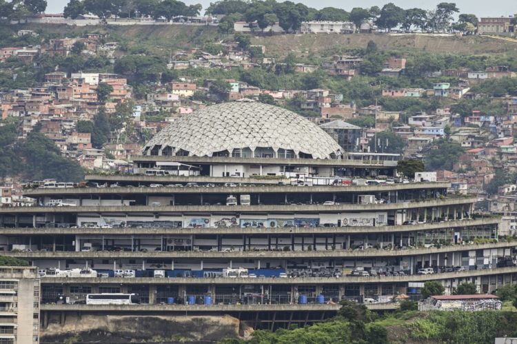 A general view of the El Helicoide building, headquarters of the Bolivarian National Intelligence Service (SEBIN) in Caracas, taken on July 28, 2023. A virtual reality project denounces "systematic torture" in the feared dungeons of El Helicoide, where the intelligence service of Venezuela operates. "We are looking for decision makers to promote the closure of torture centres. We want the Helicoide to be closed," Victor Navarro, director of Voces de la Memoria, the NGO that developed the project, said in an interview with AFP in Buenos Aires, where he has been living for four and a half years as a refugee. (Photo by Yuri CORTEZ / AFP)